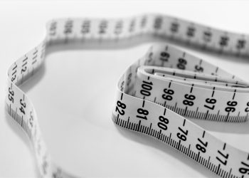 selective focus photography of tape measure