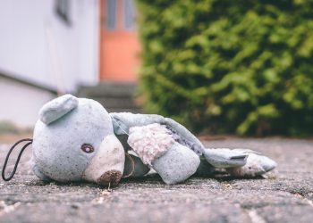 photo of bear plush toy on pavement