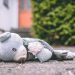 photo of bear plush toy on pavement