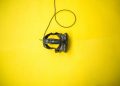 black VR smartphone headset on yellow surface