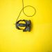 black VR smartphone headset on yellow surface
